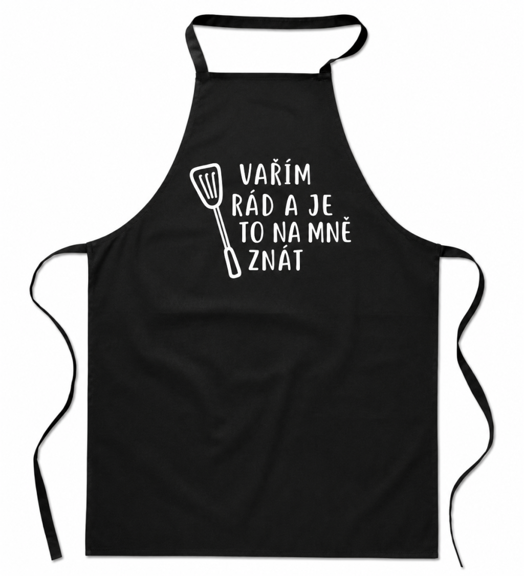 Zástěra černá nápis - Vařím rád a je to na mě znát