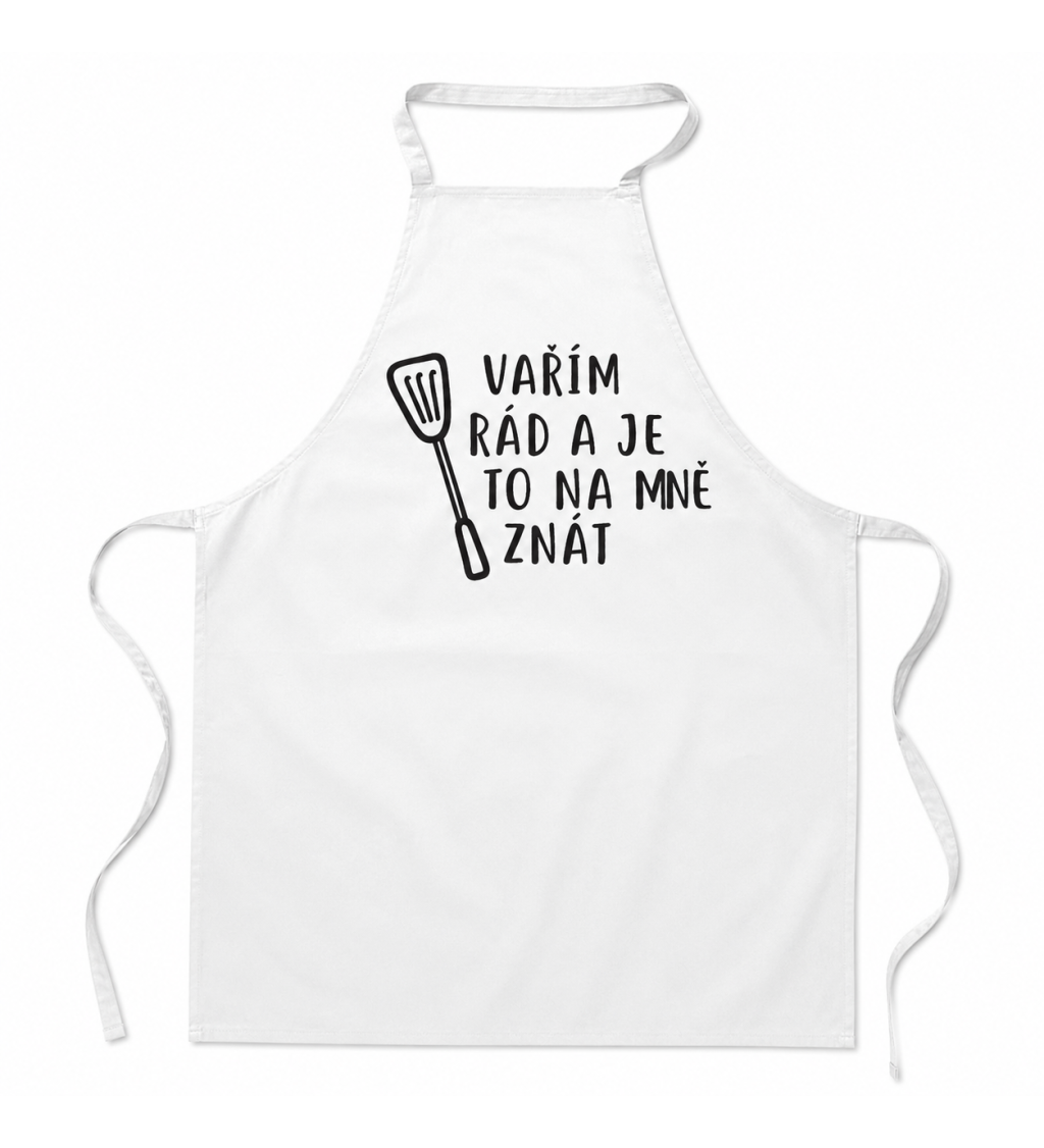 Zástěra bílá nápis - Vařím rád a je to na mě znát